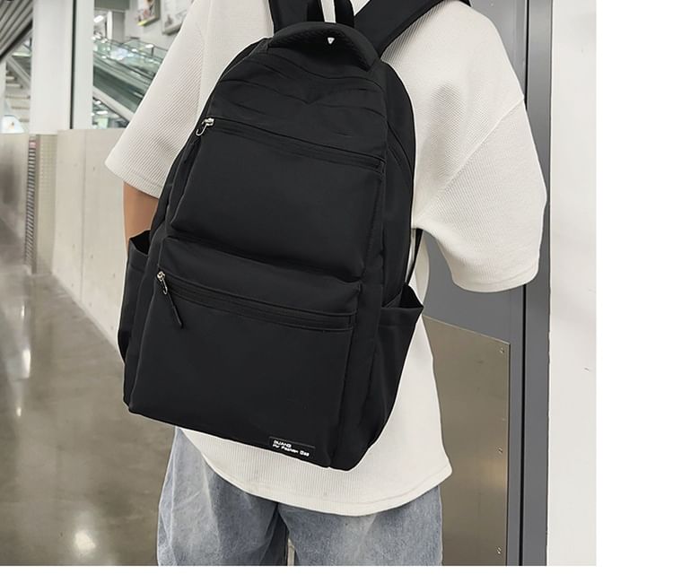 Multi-Pocket Backpack Applique