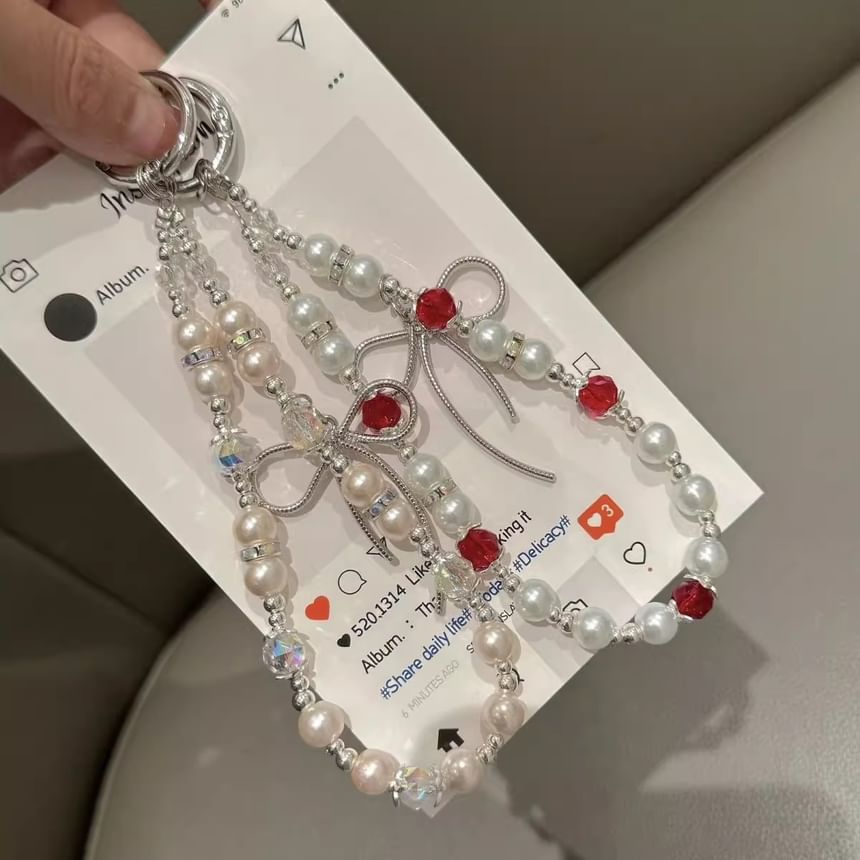 Pearl Faux Strap with Bow Lanyard Phone Pad
