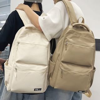 Multi-Pocket Backpack Applique
