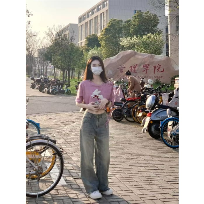 Mid Rise Fringed Washed Wide Leg Jeans